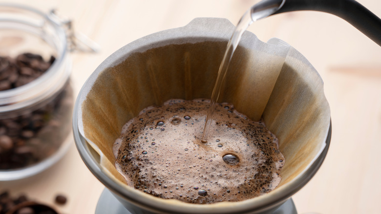 Pouring water onto filtered coffee