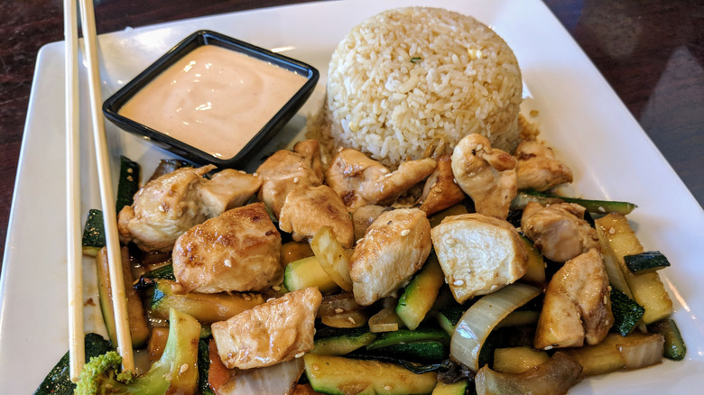 plate of hibachi chicken with sauce