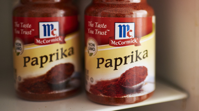 Jars of paprika on shelf