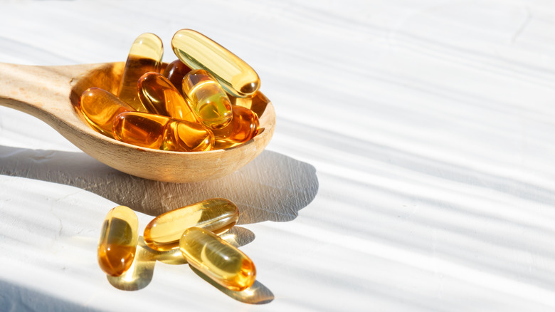 spoonful of omega-3 capsules