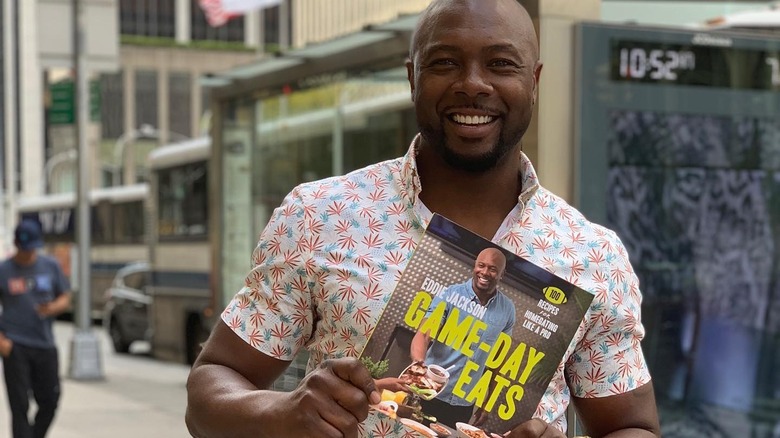 Eddie Jackson holding cookbook