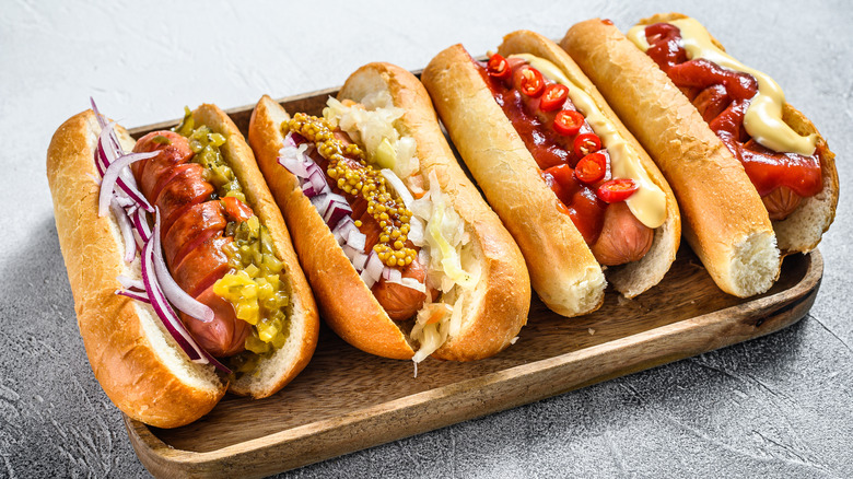 Hot dogs with assorted condiments