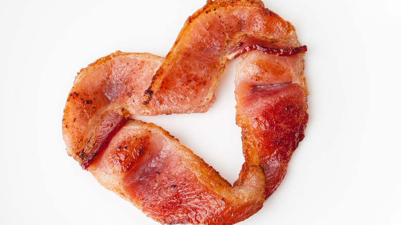 heart shaped bacon on white background