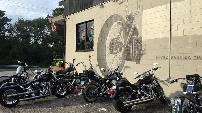 motorcycles parked outside bar