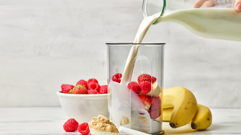 Milk poured into blender container