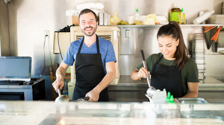 Food truck employees working together