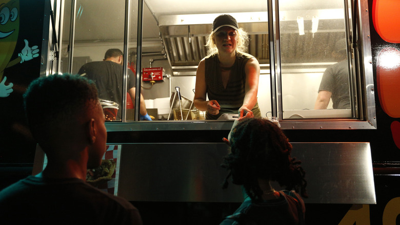 Food truck worker taking orders