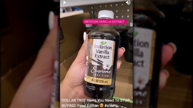 Woman holding imitation vanilla extract