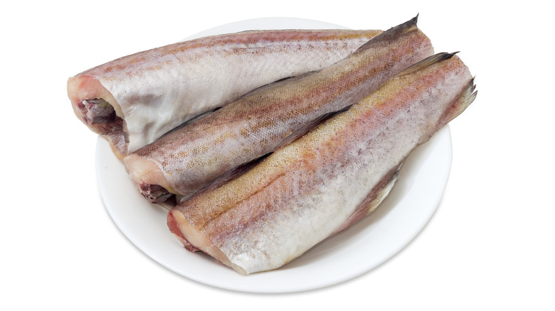 Trio of Alaska pollock filets on plate