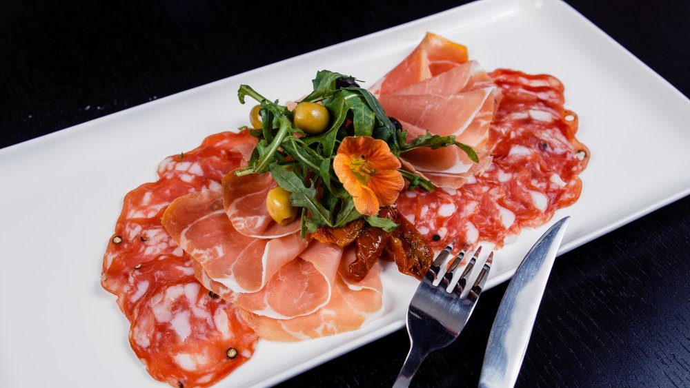 Italian meat platter containing both pancetta and prosciutto
