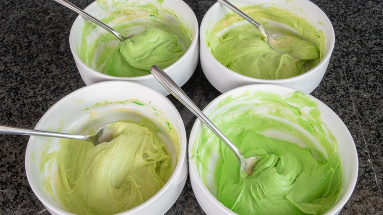 four bowls of cake batter