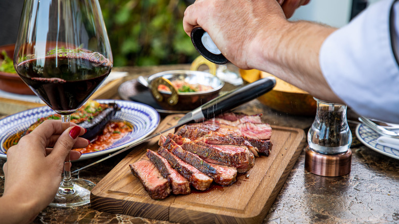 Chef seasoning steak