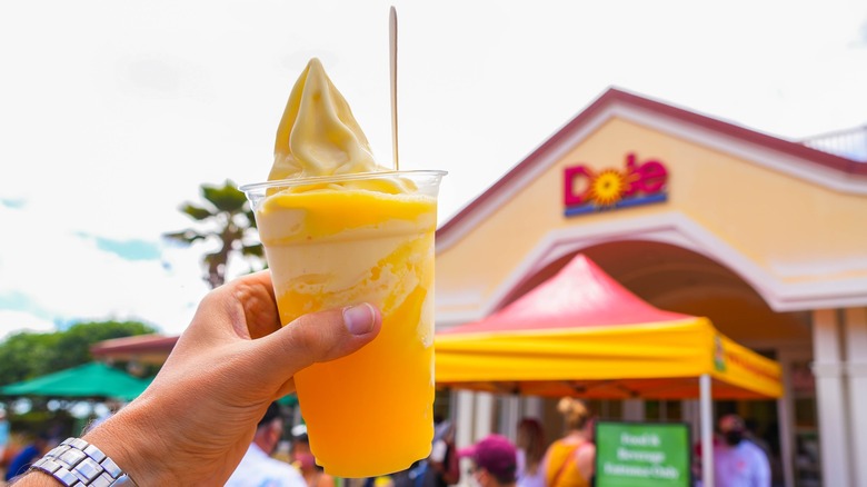 Hand holding up Dole Whip