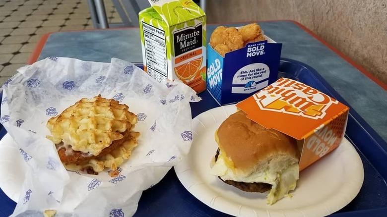 white castle breakfast slider, waffle slider, hash brown nibblers, and orange juice