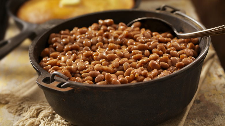 a pot of beans being stirred