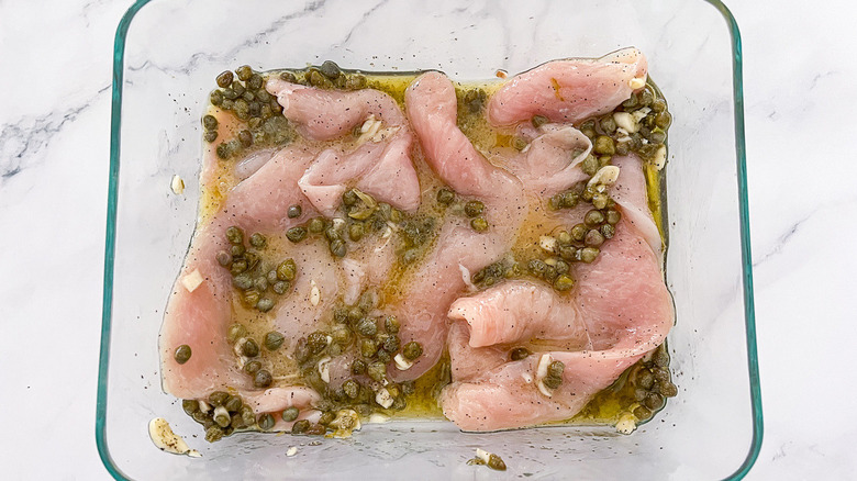 raw chicken with capers