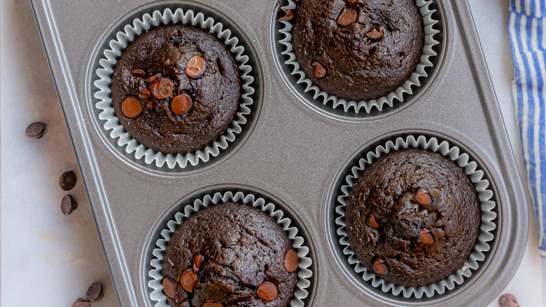 Chocolate muffins with striped towel