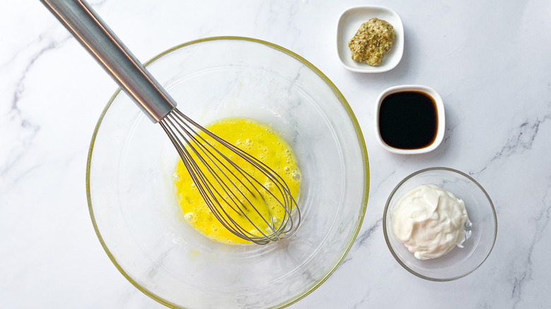 Crab cake ingredients with mixing bowl