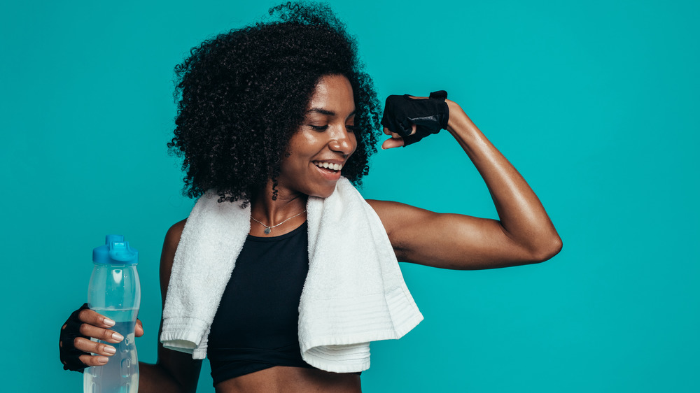 Woman flexing muscles