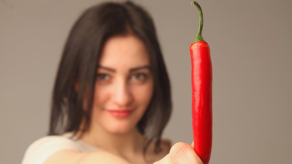 Woman with chile pepper