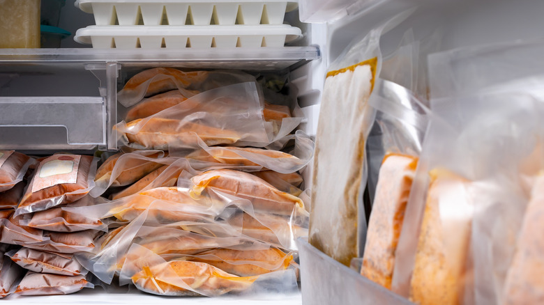 Frozen packaged salmon in freezer