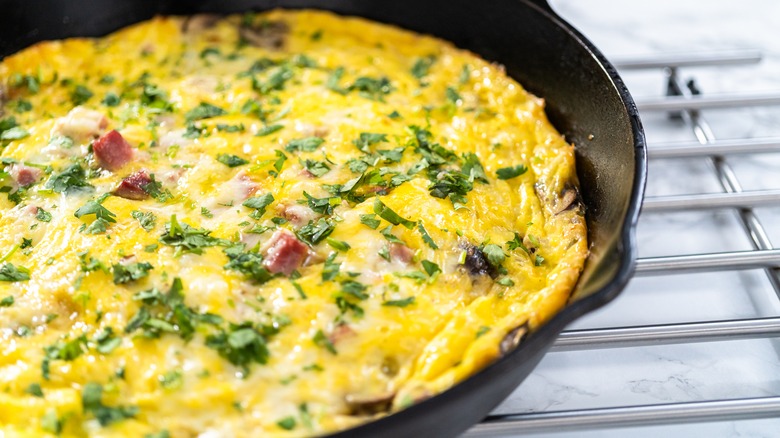 cast iron pan with omelette