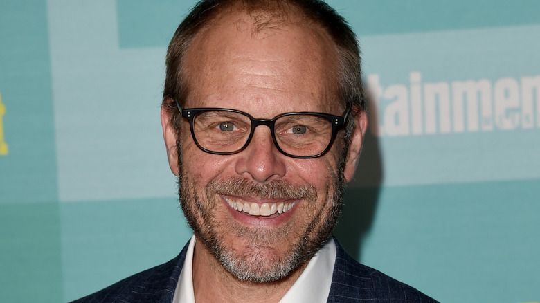 Alton Brown smiling in a close-up shot