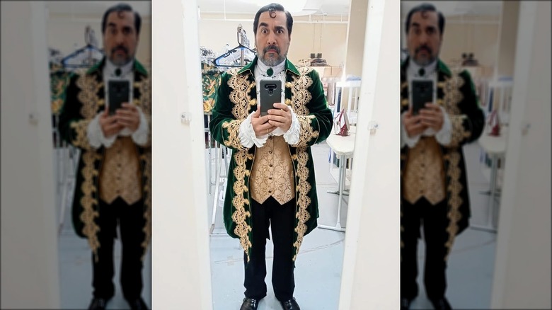 Man in costume taking mirror selfie