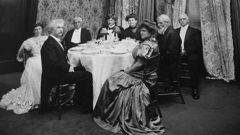 Mark Twain and guests seated at Delmonico's restaurant 