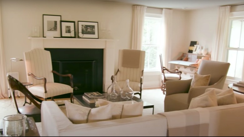 Ina Garten's living room with couches, chairs, and fireplace