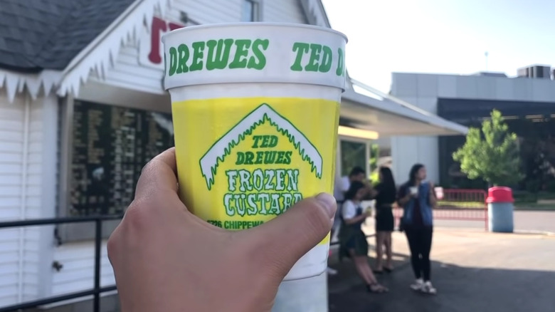 Hand holding Ted Drewes anniversary cup