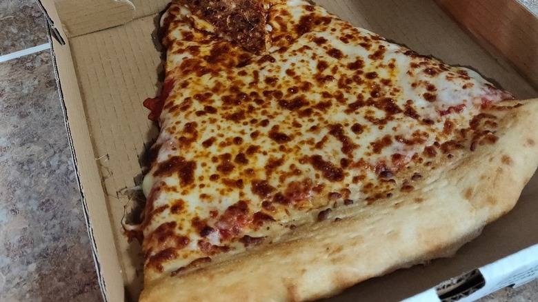 large slice of cheese pizza