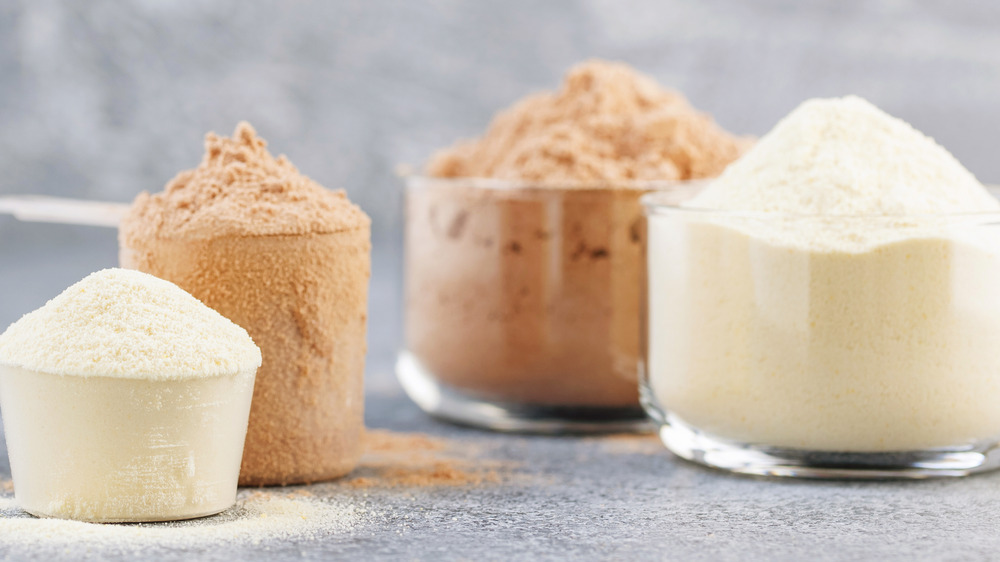 protein powder in cups and bowls