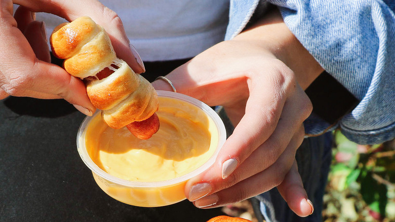 Dipping pretzel dog