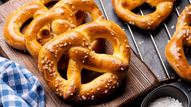 Fresh salted pretzels on a board