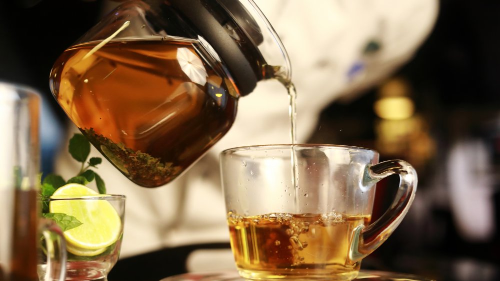 Tea being poured into a cup