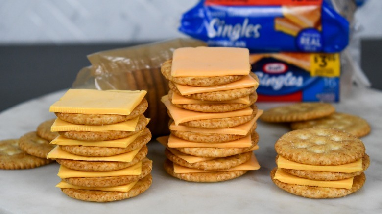 Stacks of Ritz crackers with american cheese from Kraft and Aldi