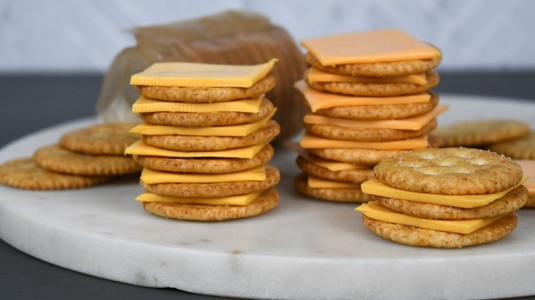 stacks of ritz crackers and american cheese from kraft and aldi