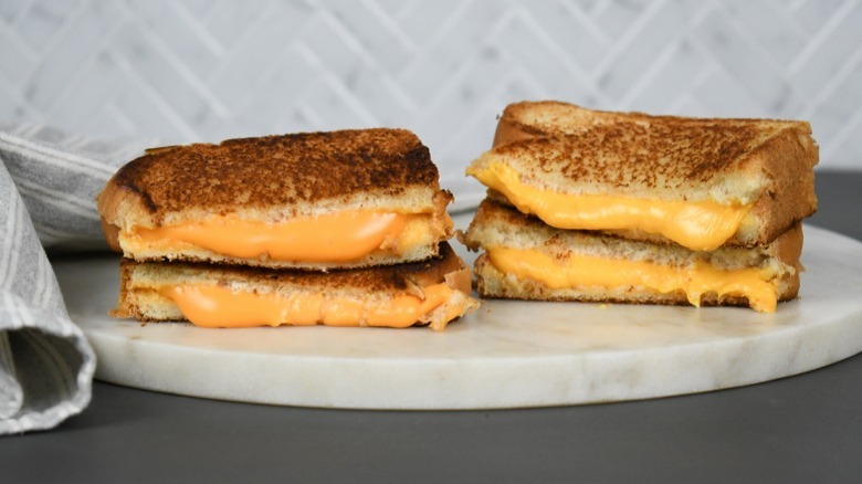 Grilled cheese sandwiches made with two different types of American cheese