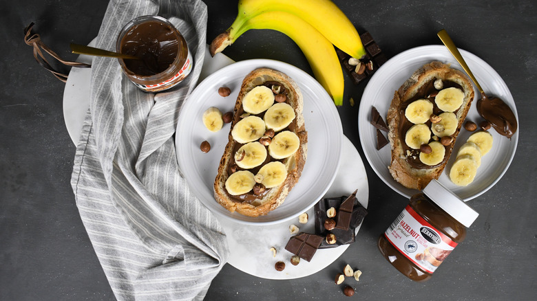 Toast with Nutella, ALDI Berryhill hazelnut spread, bananas, chocolate, and nuts