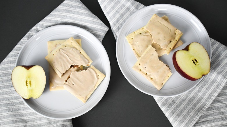 plates of pop tarts and toaster tarts with an apple for breakfast