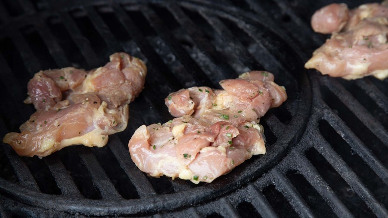 uncooked chicken on a grill