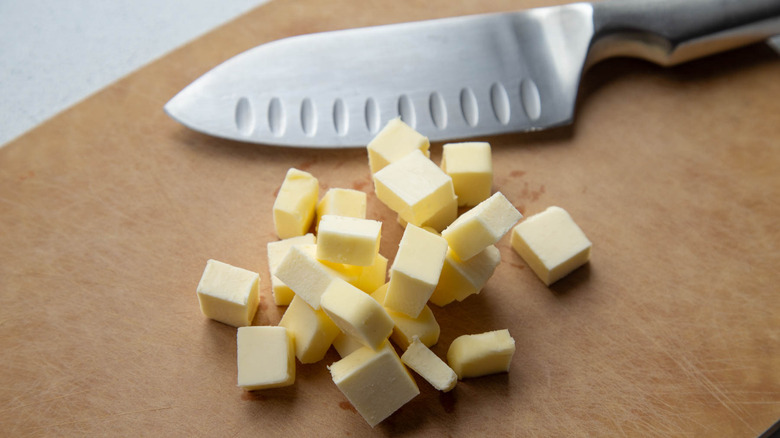 cubed butter on cutting board