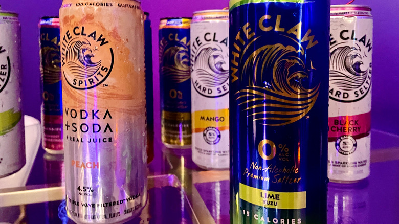 A collection of different kinds of White Claw cans