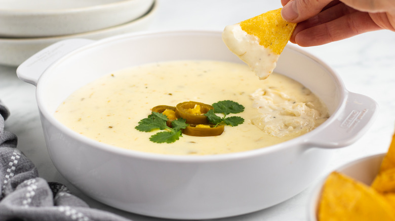 white queso (with a little green) in bowl 