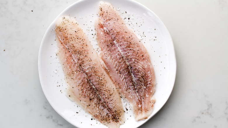 salt and pepper seasoned raw swai fish