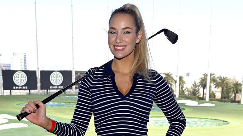 Paige Spiranac holding golf club