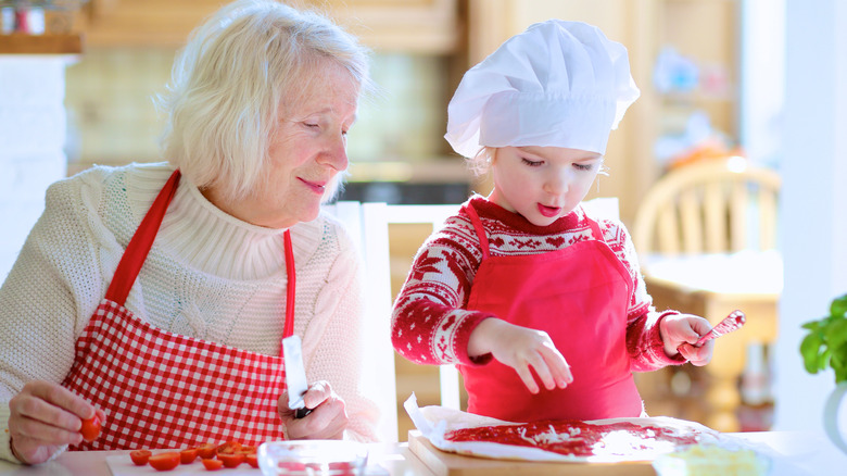 grandma and child cooking together