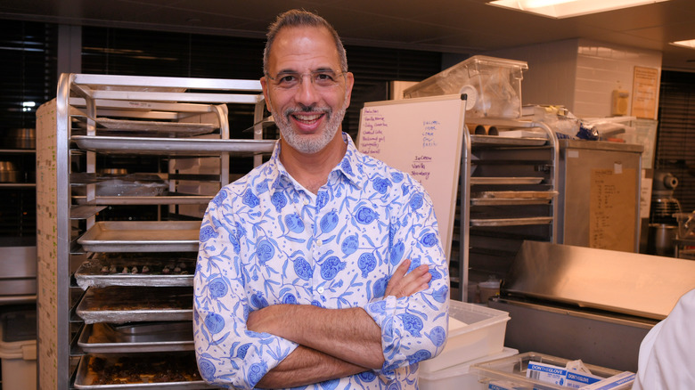 Yotam Ottolenghi looking into the camera and smiling