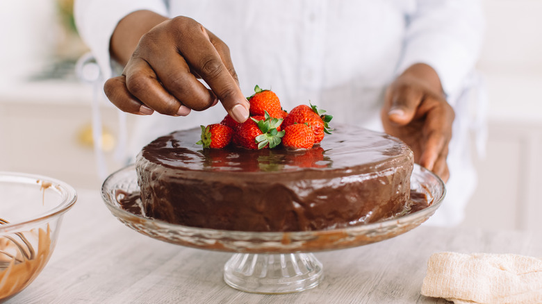 chocolate cake on glass cake stand